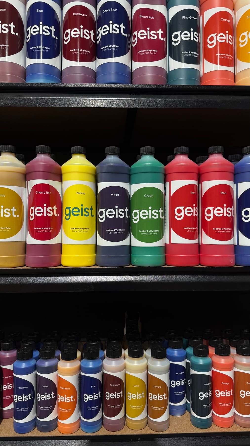 Close-up of colourful Geist leather and vinyl paint bottles